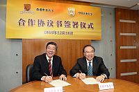 Prof. Jack Cheng, Pro-Vice-Chancellor of the Chinese University of Hong Kong (right) and Prof. Sun Qixin, Vice-President of the China Agricultural University, sign a memorandum of understanding between the two universities